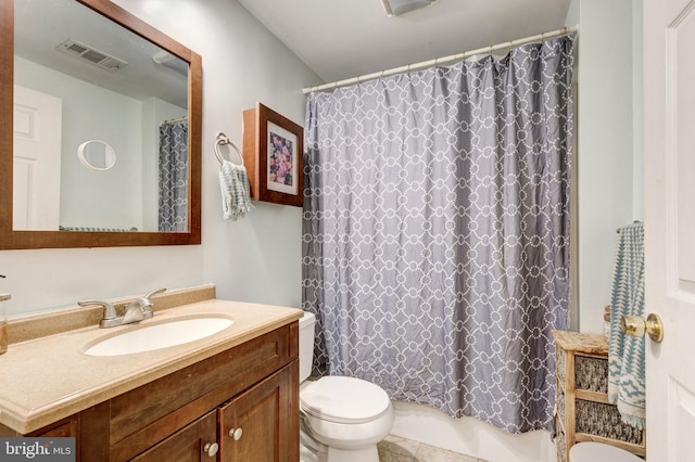 bathroom with vanity, toilet, and walk in shower