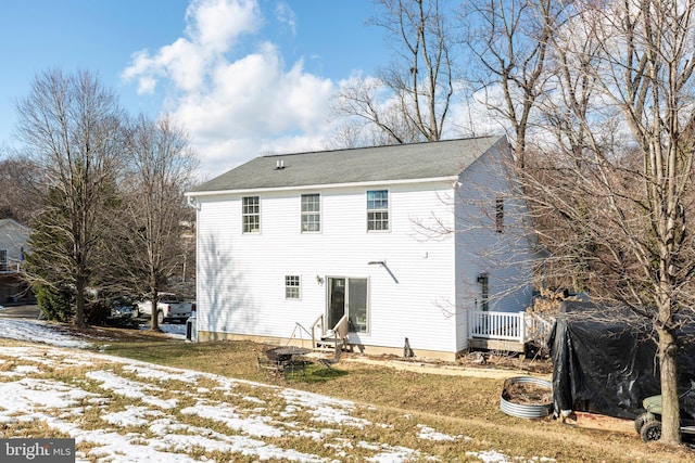 view of snow covered house