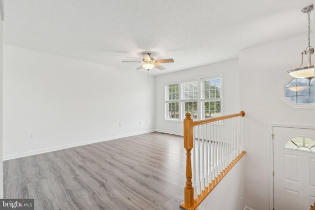 interior space featuring light hardwood / wood-style flooring and ceiling fan