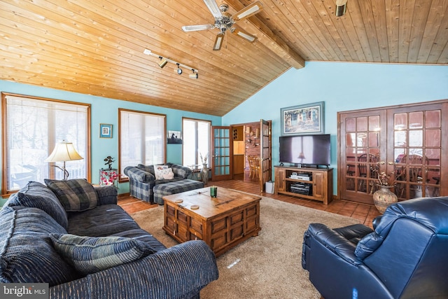 living room with lofted ceiling with beams, light tile patterned floors, wooden ceiling, track lighting, and ceiling fan