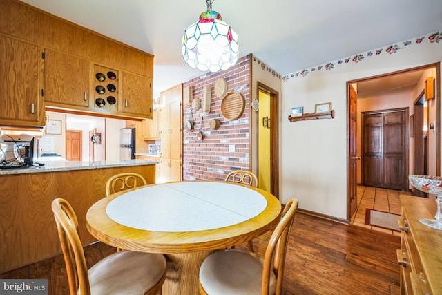 dining space with dark wood-type flooring