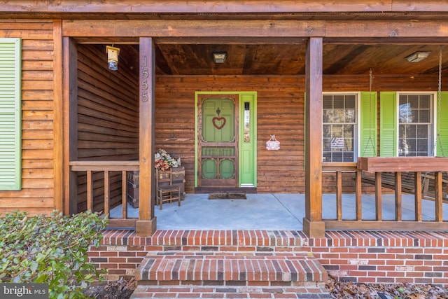 entrance to property with covered porch