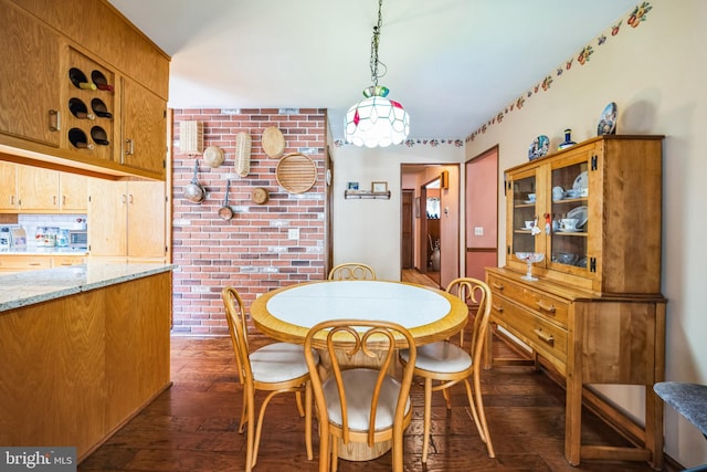 dining area with dark wood-type flooring