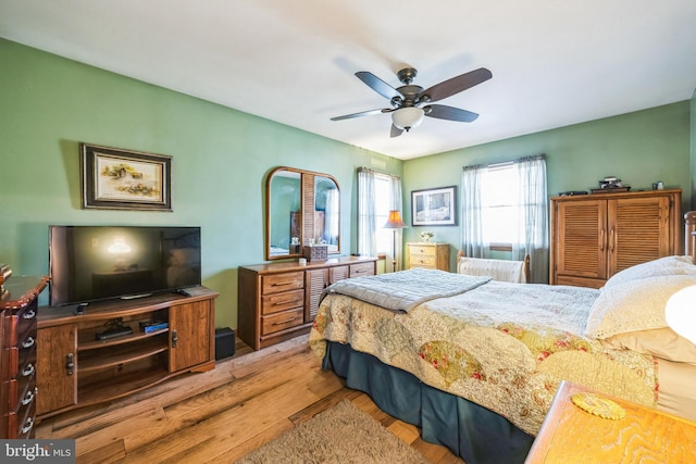 bedroom featuring light hardwood / wood-style flooring and ceiling fan