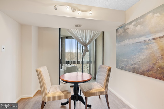 dining space featuring light hardwood / wood-style floors