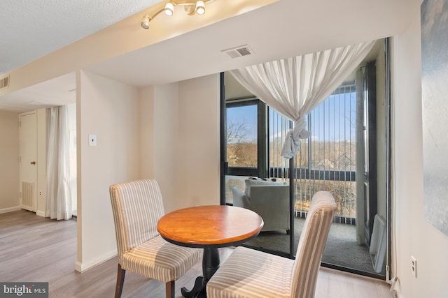 dining room with light hardwood / wood-style floors