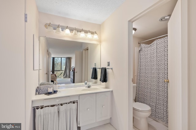 bathroom featuring a shower with curtain, vanity, a textured ceiling, and toilet