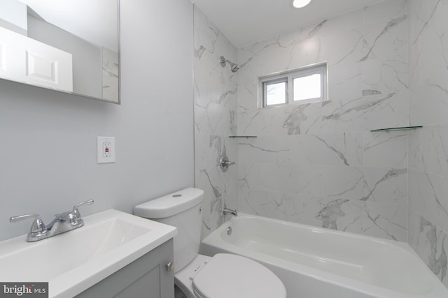 full bathroom featuring vanity, toilet, and tiled shower / bath