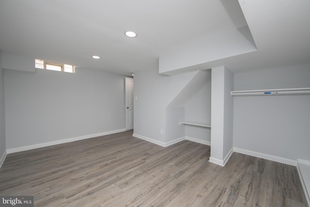 basement featuring hardwood / wood-style floors