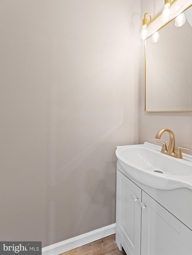 bathroom with vanity and wood-type flooring