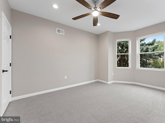 unfurnished room featuring carpet floors and ceiling fan