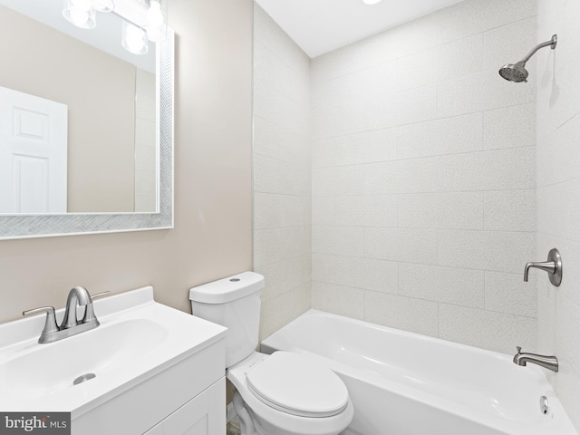 full bathroom featuring vanity, toilet, and tiled shower / bath