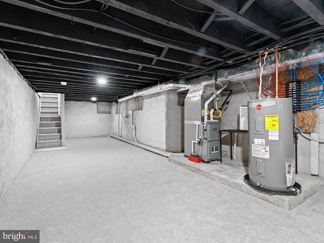 basement featuring electric water heater and heating unit