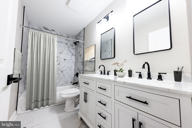 bathroom featuring a sink, marble finish floor, double vanity, and shower / bath combo with shower curtain