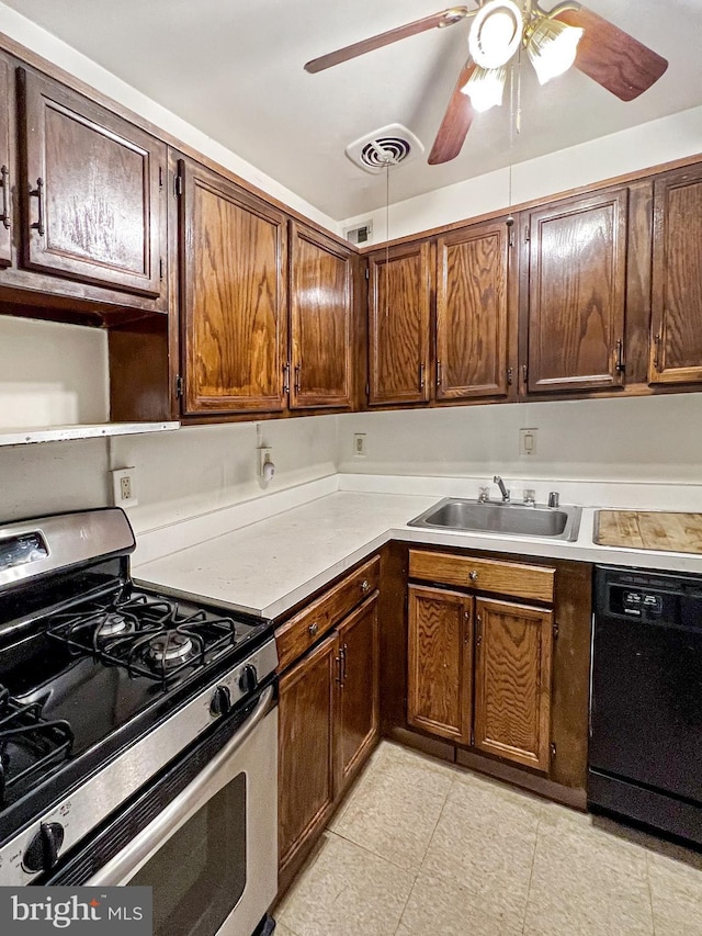 kitchen featuring gas stove, dishwasher, sink, and ceiling fan