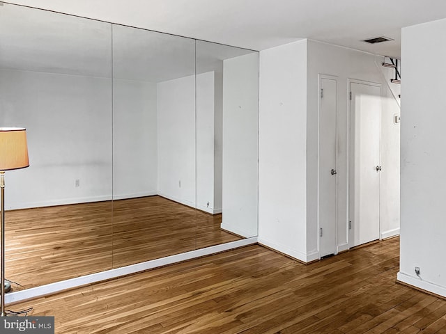 interior space with dark hardwood / wood-style flooring