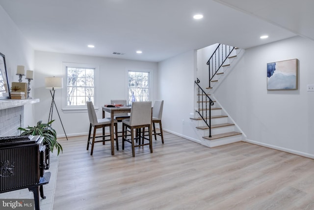 dining space with light hardwood / wood-style flooring