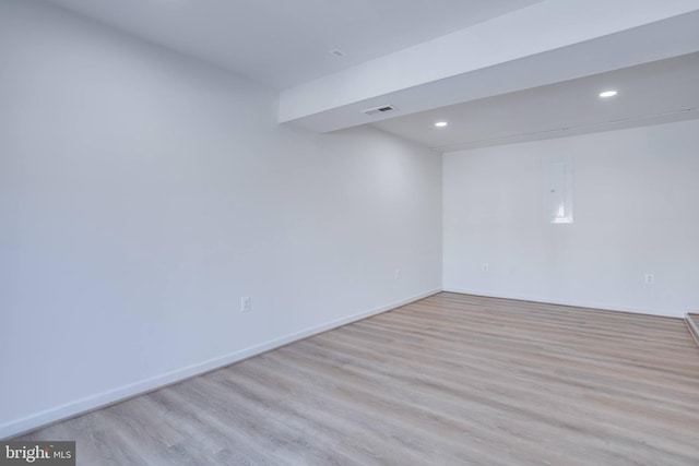 spare room featuring light hardwood / wood-style flooring