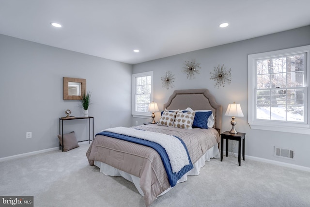 bedroom featuring light colored carpet