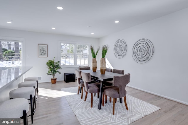 dining area featuring light wood-type flooring