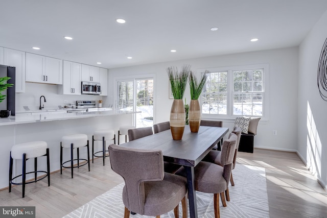 dining room featuring light wood-type flooring