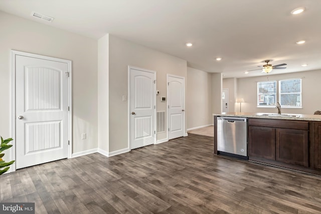 kitchen featuring sink, stainless steel dishwasher, ceiling fan, dark brown cabinetry, and dark wood-type flooring