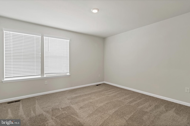 view of carpeted spare room