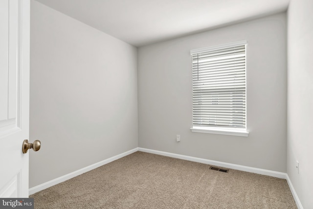 empty room featuring carpet flooring