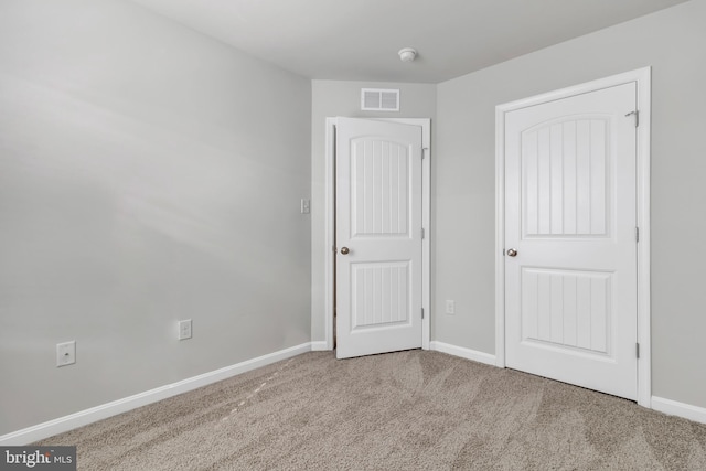 unfurnished bedroom featuring carpet