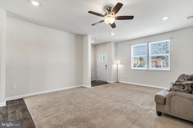 unfurnished room with dark hardwood / wood-style floors and ceiling fan