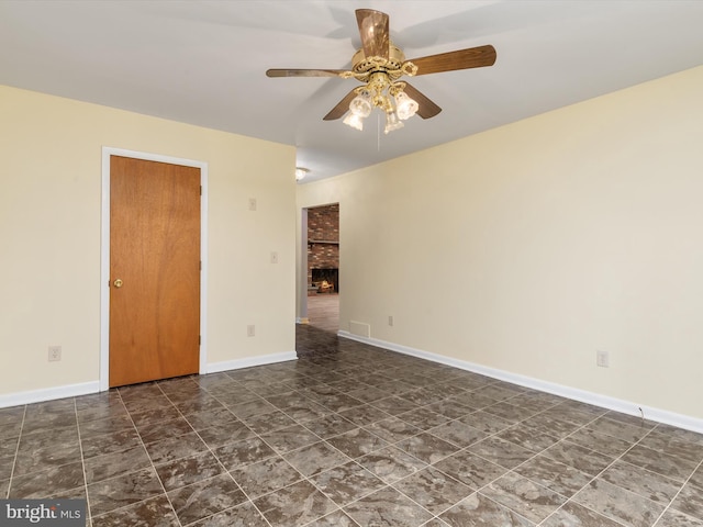 empty room featuring ceiling fan