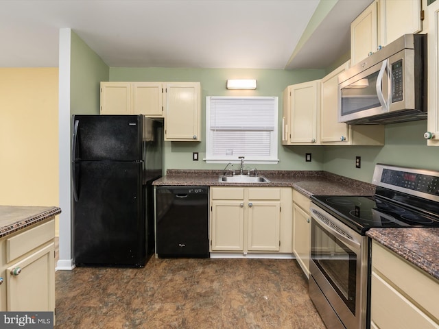 kitchen featuring cream cabinets, sink, and black appliances