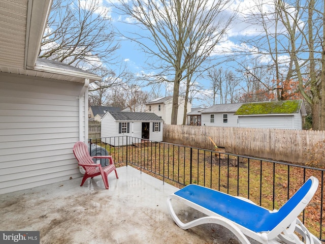 view of patio featuring an outbuilding