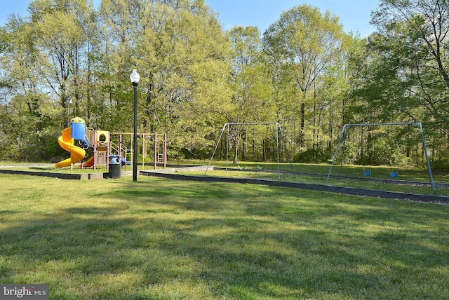 view of community featuring a yard and a playground