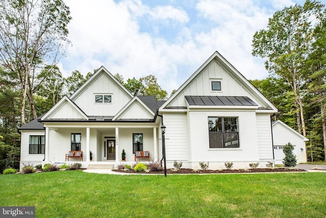 modern inspired farmhouse with a porch and a front yard