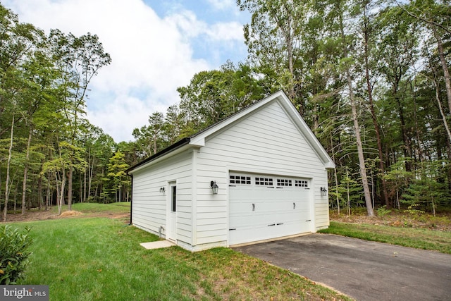 garage with a yard