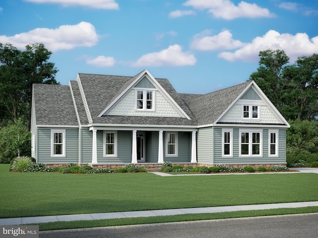 view of front of home with a front yard and covered porch