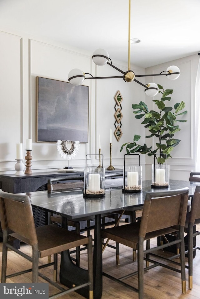 dining area with hardwood / wood-style flooring