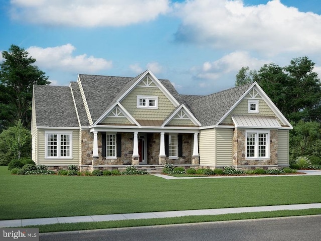 view of front of property with covered porch and a front yard