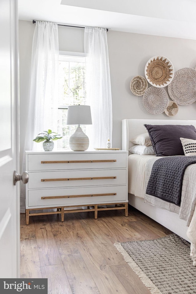 bedroom with light wood-type flooring