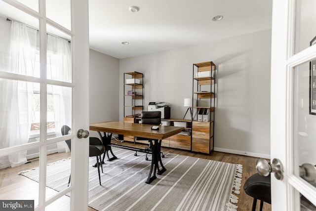 office area with hardwood / wood-style flooring and french doors