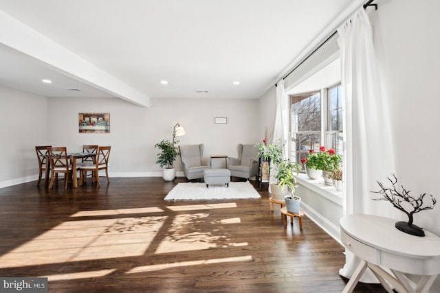 sitting room with dark hardwood / wood-style flooring