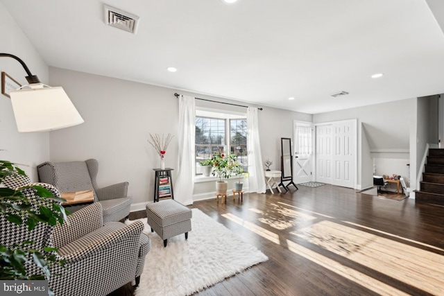 living room with dark hardwood / wood-style flooring