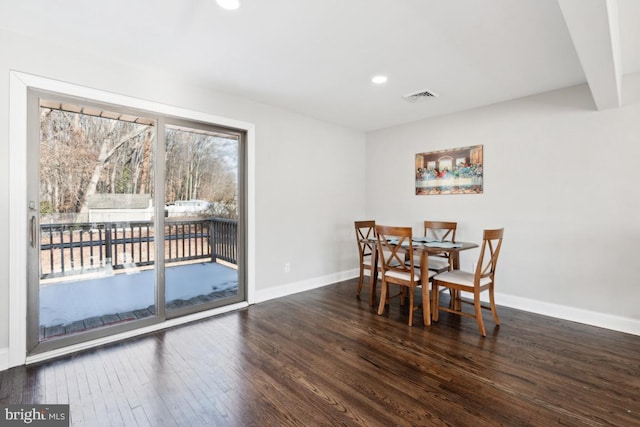 dining space featuring dark hardwood / wood-style floors