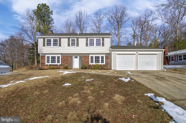 view of front of home with a garage and a front yard