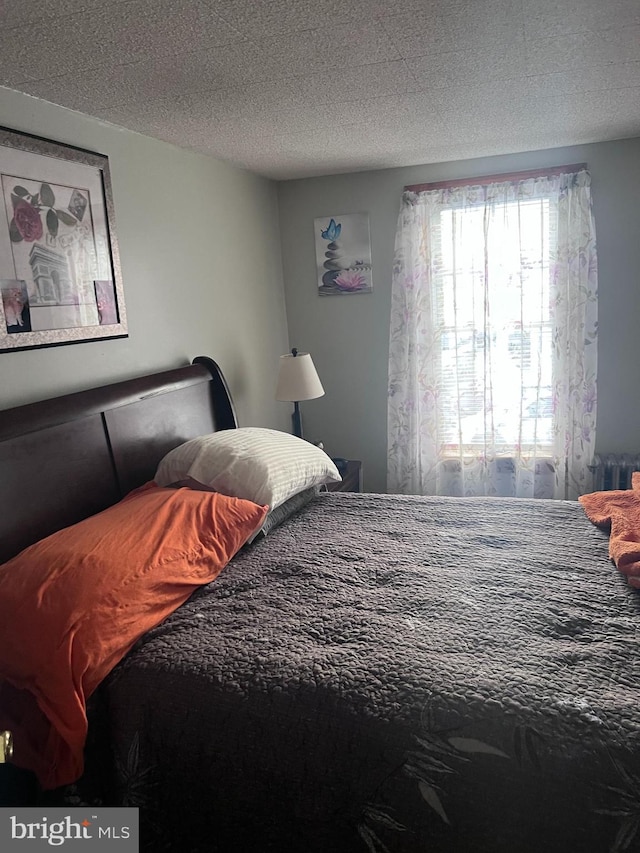 bedroom featuring a textured ceiling