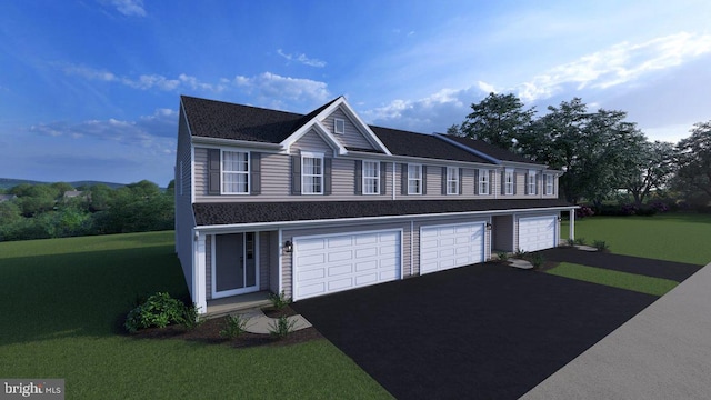 view of front of property featuring a garage and a front yard