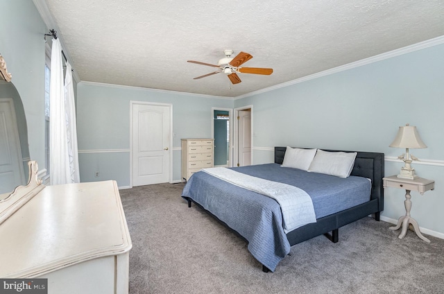 bedroom featuring ornamental molding, carpet flooring, and a textured ceiling