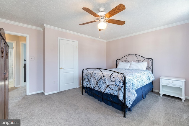 carpeted bedroom featuring ornamental molding, ceiling fan, and a textured ceiling