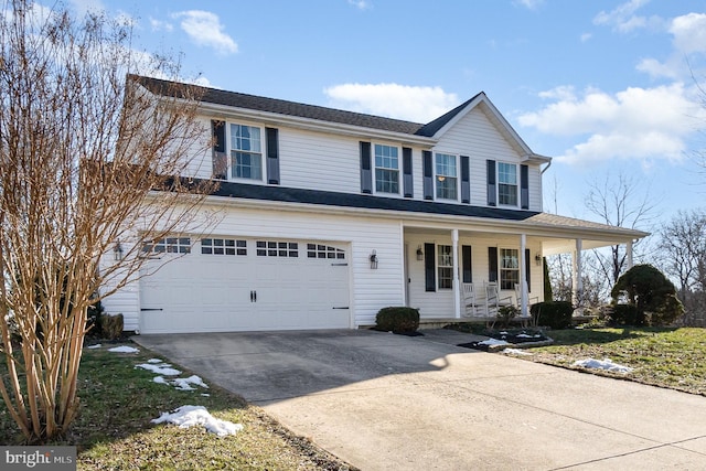 view of front of house featuring a porch and a garage